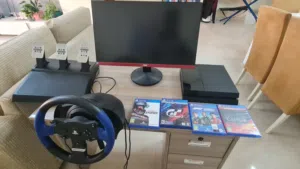 PS4 FOR SALE WITH SIM RACING WHEEL ,PEDALS,4 GAMES, MONITOR ,TABLE