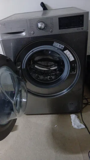 Front-load washing machine - stainless steel, good working condition