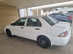 سيارةً لانسر 2010 ملكيه سنه