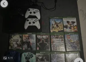 xbox one console + 3 controllers + 10 good as new cds + 2 controller cover...