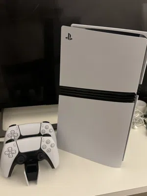Ps5 pro with 2 controllers and charging station used only 5 months