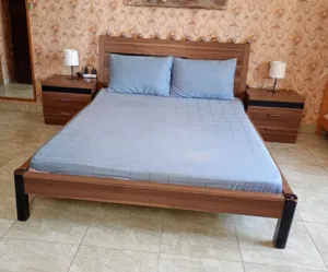 bed with mattress and side tables
