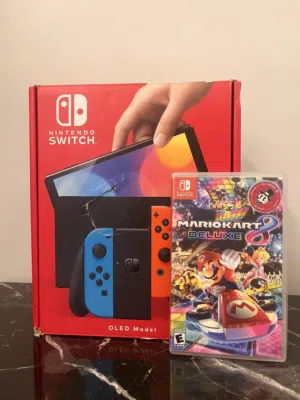 Nintendo switch oled -نينتيندو سويتش اوليد بحالة الوكالة مع الكرتونة والاكياس ولعبة اضافية