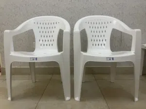 2 White Plastic Chairs