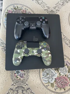 PlayStation 4 Slim Console with two controllers