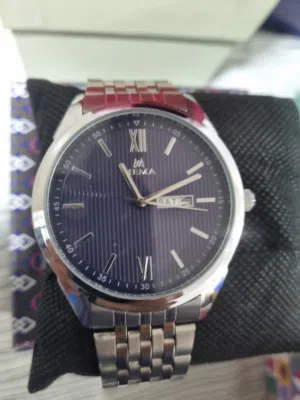 Original Mema Watch New Blue background.