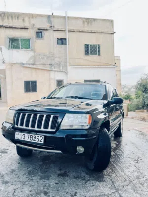 جيب جراند شيروكي 1999 محدثه بالكامل 2004 لاردو أسود مستعمل مع مواصفات يابانية ومرخصة