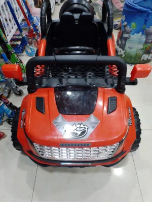 سيارة موديل  2026 لون احمر تفتح أبوابها مع موسيقى واناره يتحمل أوزان لغاية 40 كيلو و اكثر