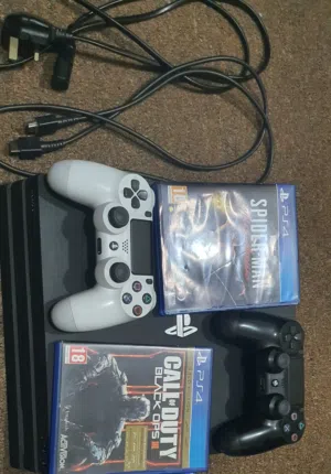 playstation 4 pro with 2 original controllers and 2 discs جهاز بلايستيشن 4 برو مستعمل مع ذراعين تحكم