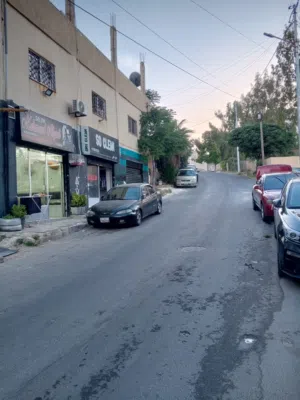 ارض تجاري (ب)مع بيت