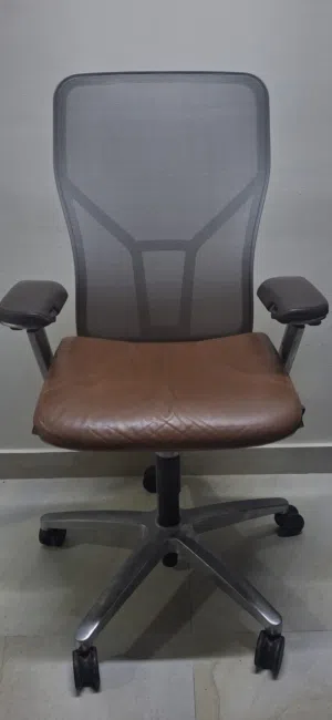 Allsteel Acuity task chair with a brown leather seat and mesh back