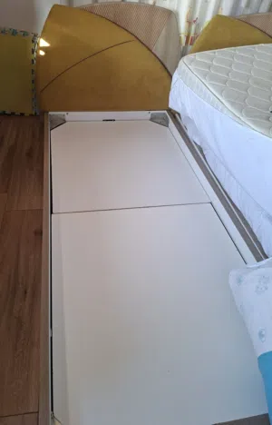 Bedroom: 2 beds, night stand and a wardrobe