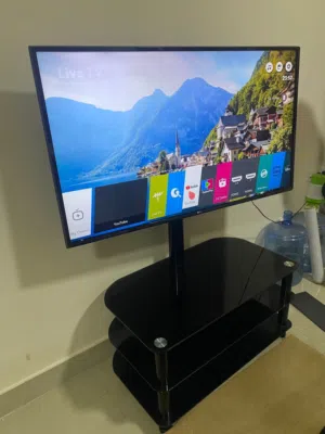 LG LED TV - 49 inch in good condition with TV Glass stand