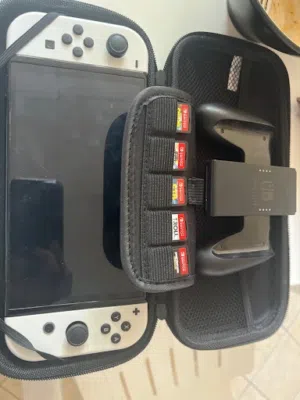 Nintendo Switch OLED 2021 ننتندو سويتش أوليد نظيف جداً + 5 ألعاب + حقيبة