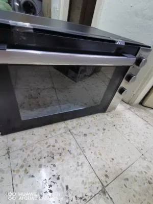 فرن كهربائي حجم كبير فصالة الباب مكسورة