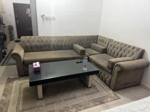 L-shaped tufted fabric corner sofa with table and Carpet