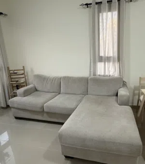 Light grey 3-seater L-shaped fabric sofa with chaise - good condition