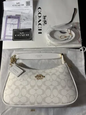 COACH Teri Shoulder Bag in Signature Canvas featuring white leather trim
