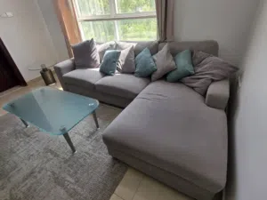 Grey L-shaped Corner Sofa with Cushions and coffee tables