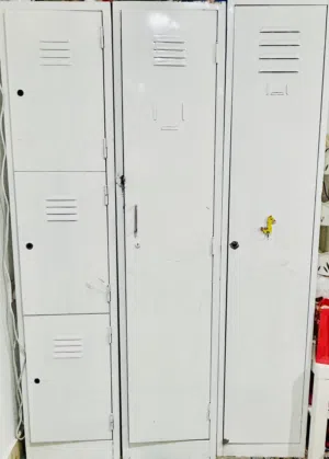 Four white steel Cabinets and One Dark Wood Cabinet.