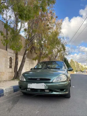 سيارة كيا ريو 2002 موديل صالون بألوان أخضر ,مرخصة سنة كاملة, ماتورها 1500,فحصها خالي قص قلبان