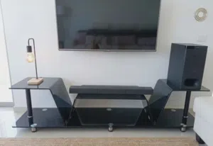 طاولة تليفزيون مودرن زجاجية.. TV Stand... Black glass TV console unit