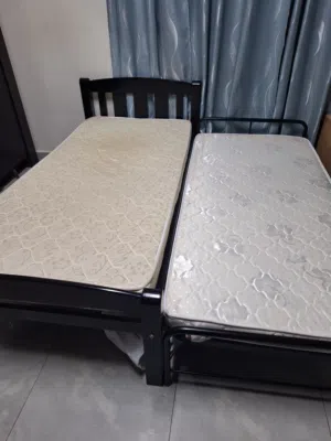 2 Wooden single bed with new (homecenter Metrus) & 1 iron bed with new meteus for urgent sale