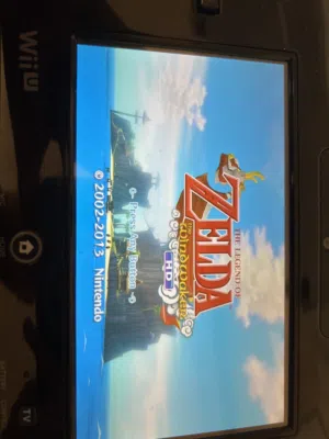 Wii U bundle with 4 original remotes nunchucks Mario Kart 8 Zelda HD 7 games ready to play.