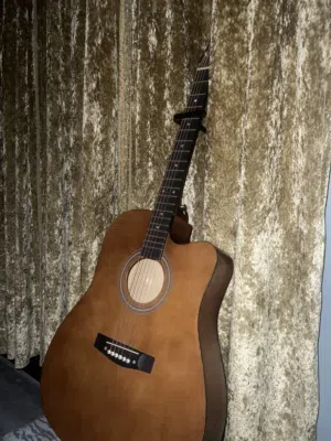 Beginner Acoustic Guitar With brand new strings capo, a little damaged bag, plectrums, and more