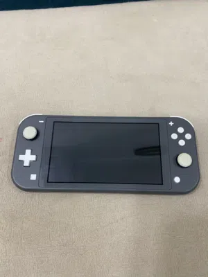 Nintendo Switch Lite اللون الرمادي و الابيض