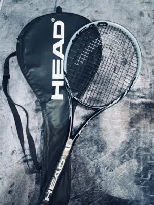 Head brand tennis racket, not old, used only once. If you're serious and want it, contact me.