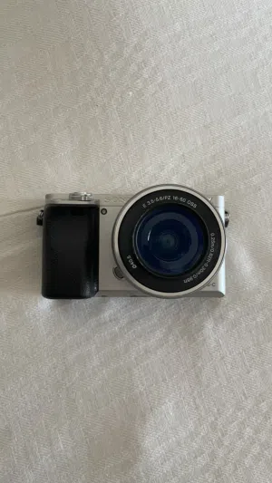 Sony a6000 Mirrorless Camera Kit (Silver) + Dual Charger & Extra Batteries Shutter count 8914.