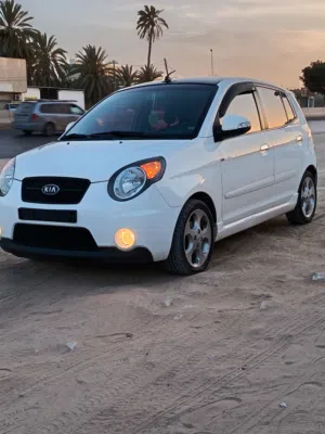 كيا بيكانتو 2008 جمرك رسالة مفتوحه خالية من العيوب لون ابيض وداخليه اسود مكيفة خالية