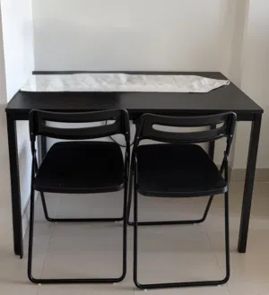Dinner table with two chairs