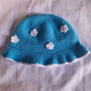 handmade crochet light blue bucket hat with white cloud appliques adult size