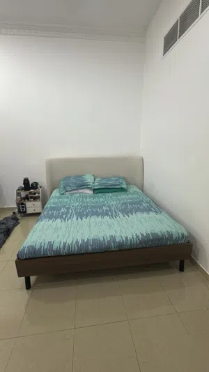 King size bed frame with mattress, solid wood base (brown color) Homecenter brand