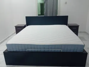 Like new King bed with built in storage including 2 night stands for 100 KWD
