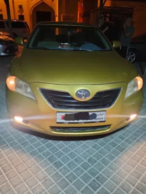 تويوتا كامري  2007  GLX  ذهبي تخشيبة وستارة خلفية  شاشة وكاميرا
