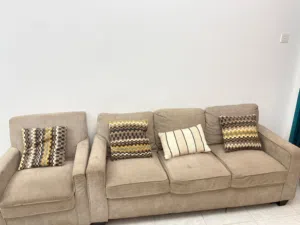Selling a spacious 7-seater sofa set in a neutral beige color.