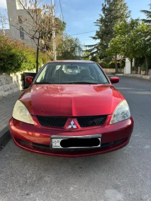 ميتسوبيشي لانسر موديل 2007 فابريكة الدهان وخالية من العيوب مع تأمين مرخصة