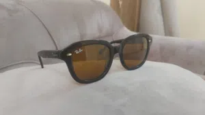 Ray Ban sunglasses. 100% genuine. Sturdy and vintage look. Thick frame. Perfect condition.