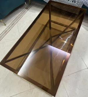 Bronze-Tinted Glass Coffee Table with Golden Frame – Elegant Design