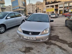 ميتسوبيشي لانسر موديل 2012، لون ذهبي، صالون، أوتوماتيك، مستعملة بحالة ممتازة