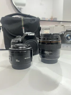 Canon Eos 2000D with 2 prime lens 85mm 1.8 and 50mm 1.8 and charger box everything