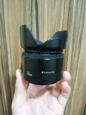 عدسة كاميرا كانون مستعمل مع مشكلة في الautofocus بس على وضع ال manual أمورها تمام