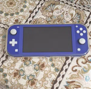 Nintendo Switch Lite Bundle (blue colour) – Excellent Condition