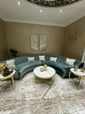 Beautiful curved 6 seater sofa and 3 piece marble /gold coffee tables