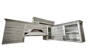 Grey wall kitchen cabinets with built-in chimney hood