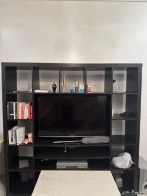 Italian TV showcase with tea table