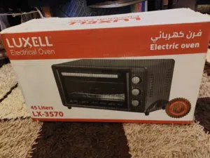 فرن كهرباء جديد بكرتونة مامستعمل نهائي لون ابيض نوع لوكسيل 45 لتر مع صواني عدد (2)